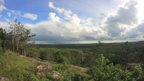 Time-lapse-of-clouds-and-rain-storm-moving-over-the-forests-of-northern-Michigan