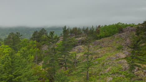 Time-lapse-of-fog-and-clouds-swirling-around-the-rocky-hills-of-northern-Michigan