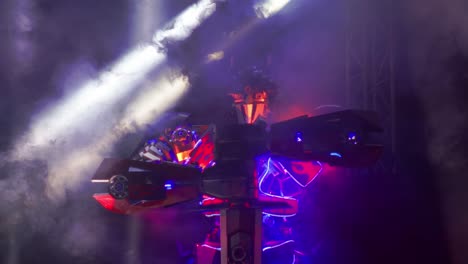 A-shot-of-the-Optimus-Prime-transformer-with-the-lights-on-and-lots-of-smoke-all-around
