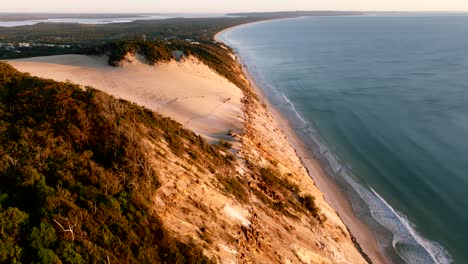 Morning-drone-flight-at-Rainbow-beach-in-Queensland,-showcasing-the-empty-sand-dunes