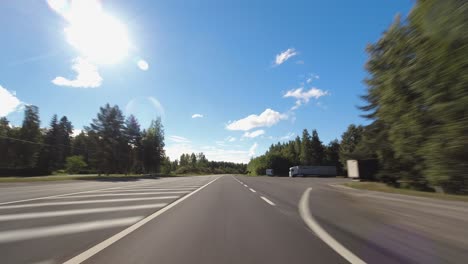 Hyperlapse-drive:-POV-highway-driving-on-quiet-rural-highway,-sunny