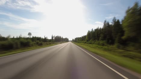 Hyperlapse-POV:-Driving-on-highway-through-northern-Pine-forest