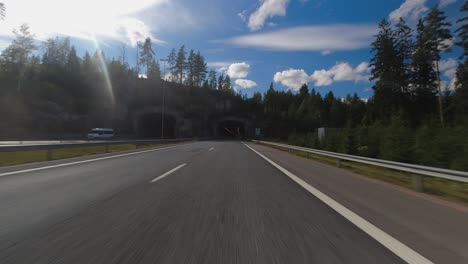 Day-time-hyperlapse-POV:-Driving-on-country-highway-through-tunnels