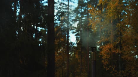 Heat-and-smoke-escape-small-wood-stove-chimney-at-forest-camp-site