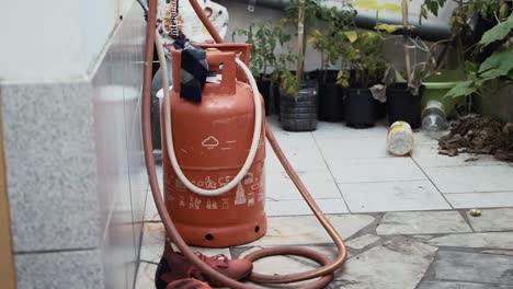 Propane-gas-cylinder-placed-outdoor-safely-for-cooking