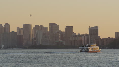 New-York-Waterway-Ferry-Crossing-The-Hudson-During-Golden-Hour-With-Helicopter-Flying-Past