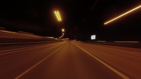 Night-hyperlapse:-Lights-flash-past-in-fast-POV-city-drive-at-night