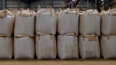 Large-sacks-and-bags-full-of-delicious-coffee-beans-within-a-coffee-production-warehouse-ready-for-distribution-and-export