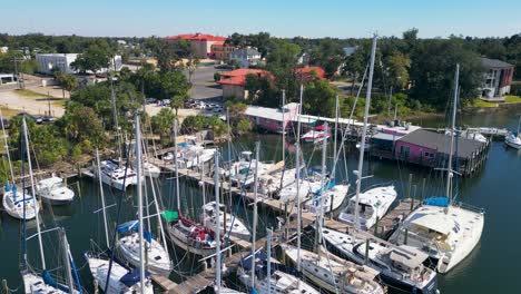 drone-footage-of-sailboats-in-marina-starting-from-height-lowering-to-water-level