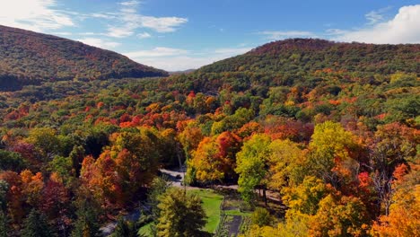 An-aerial-view-high-over-colorful-trees-during-the-fall-foliage-in-upstate-NY