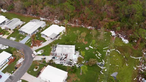 4K-Drone-Video-of-Debris-in-Pine-Trees-from-Homes-Destroyed-by-Hurricane-Ian-in-North-Port,-Florida---21