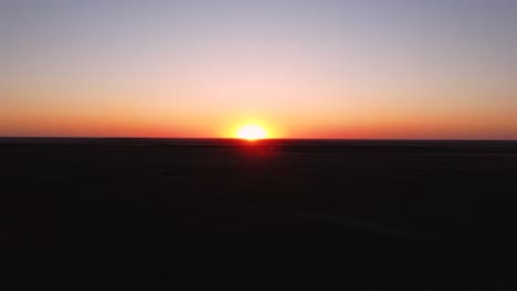 The-Sun-sets-over-the-Horizon-on-the-agriculture-field