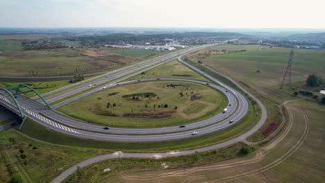 Aerial:-Traffic-on-new-modern-Intersection-and-highway-in-rural-area-of-Poland-during-summer