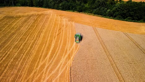 Aerial-view-of-a-combine-working-in-a-farmland