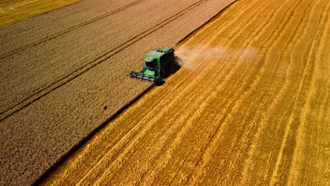 Aerial-view-of-a-combine-working-in-a-farmland