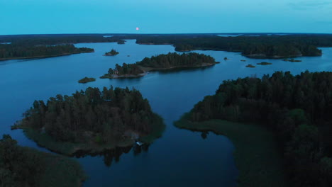 Moon-rise-over-Scandinavian-archipelago-islands-in-4k