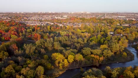 Aerial-fall-view-at-a-park-with-a-river-in-the-middle