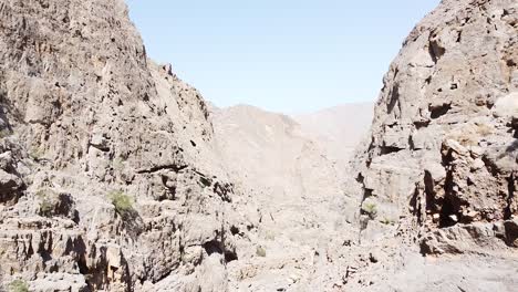 Drone-shot-of-rocky-desert-mountains-in-Khasab,-Oman