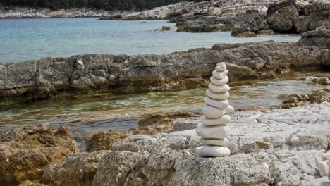Stack-Of-Stones-On-The-Sea-Beach-Of-Paralia-Emplisi-In-Greece---static-shot