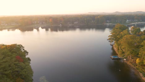 An-Autumn-sunrise-over-Mona-Lake-in-Muskegon,-Michigan