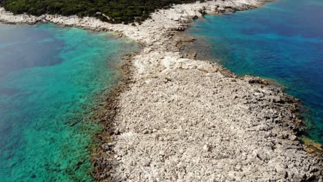 Alexia-Beach-With-Clear-Waters-And-Rocky-Coastline-At-Summer-In-Greece