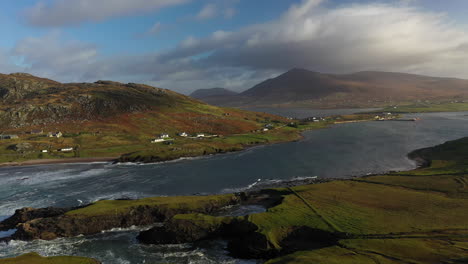 Cinematic-wide-revealing-drone-shot-of-a-river-and-inlet-at-the-White-Cliffs-of-Ashleam,-Ireland