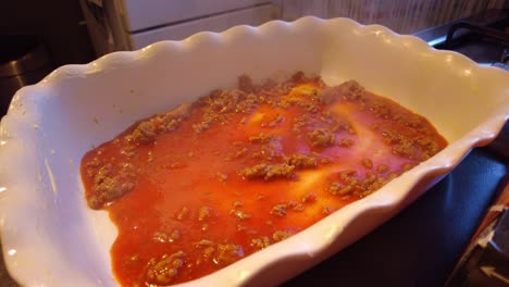 Close-Up-View-Of-Thin-Layer-Of-Hot-Bolognese-Sauce-In-Dish-Steaming-Off