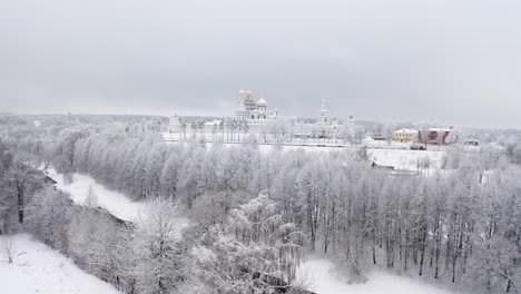 Aerial-View-Of-The-Resurrection-Monastery-In-Snowy-Winter-Landscape