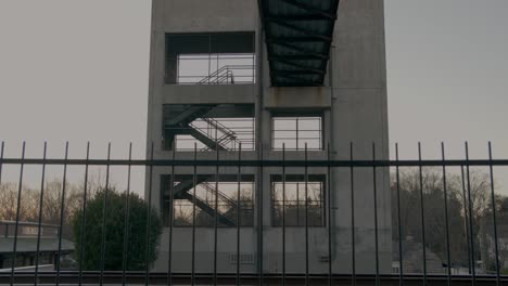A-large-structure-with-stairs-at-dusk