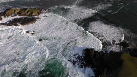 Cinematic-tilting-upward-drone-shot-of-the-White-Cliffs-of-Ashleam,-Ireland-on-the-Wild-Atlantic-Way