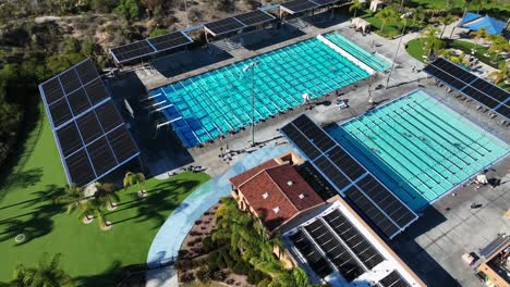 Drone-shot-over-the-Alga-Norte-community-park,Carlsbad,California,USA-with-locals-swimming-on-a-bright-sunny-summer-day