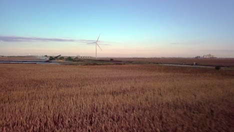 Wind-mill-Turbines-Spin-Creating-Green-Renewable-Clean-Energy-Electricity-With-Net-Zero-Greenhouse-Gas-Carbon-Footprint-Emissions-To-Reduce-Climate-Change-In-Wheat-Fields-Of-Nebraska-Stock-Video-#2