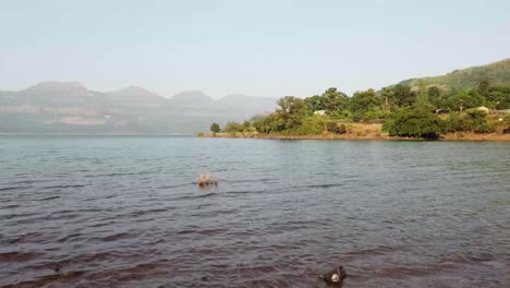 Travel-Over-Lake-Water-in-India---Mulshi-dam,-Pune-surrounded-with-hills