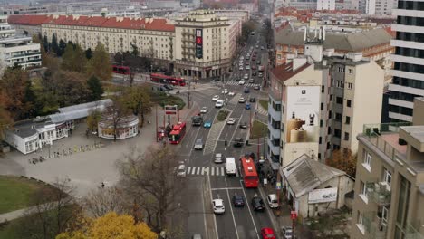 Wide-Aerial-shot-of-cars-traffic-driving-Racianske-myto-intersection-in-Bratislava,-Slovakia