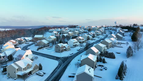 Aerial-establishing-shot-of-residential-housing-neighborhood-in-winter