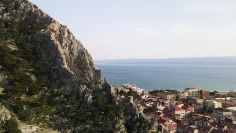 Mountainside-view-of-Omis-Town-against-sea-and-mountain-slope---Croatia