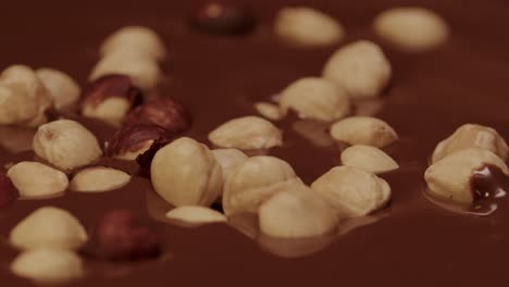 Slow-motion-of-hazelnuts-dropping-into-hot-chocolate