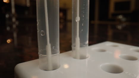Close-up-of-cotton-swabs-in-test-tubes-for-Covid-19-coronavirus-rapid-testing