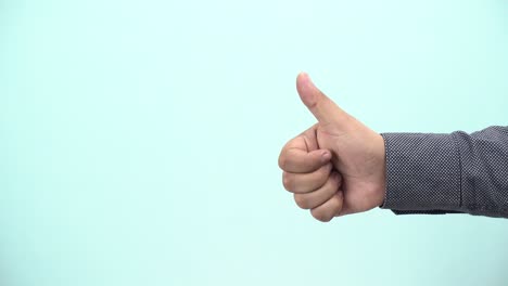 a-businessman-showing-thumbs-up-on-blue-background