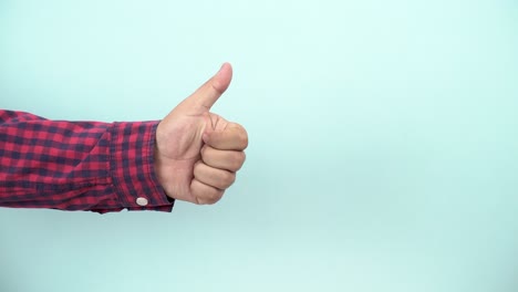 person-thumbs-up-on-blue-background