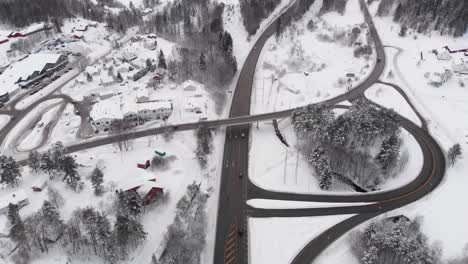 Modern-Highway-In-Snow-Covered-Norwegian-Landscape---aerial-shot