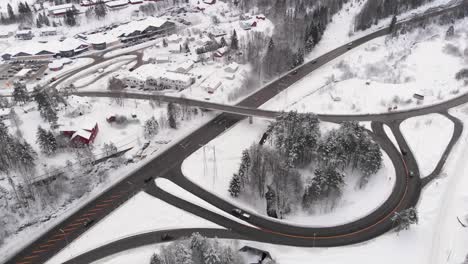 Curved-Roads-And-Narrow-Highway-In-Snowy-Norway-Winter---aerial-shot