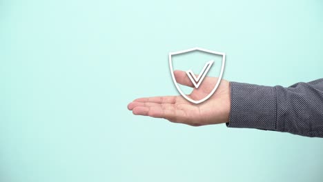 hand-holding-protect-shield-with-a-check-mark-icon-on-blue-background