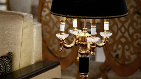 Close-Up-View-Of-Stylish-Four-Light-Lamp-With-Shade-Hood