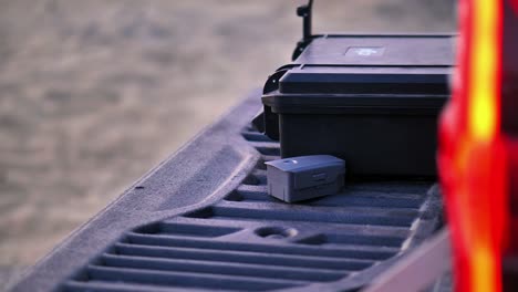 View-Of-Back-Of-4x4-Pick-Up-Truck-With-Hard-Travel-Case-Resting
