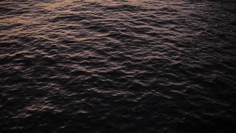 Sunset-light-reflecting-on-the-water-surface-of-the-sea-lake