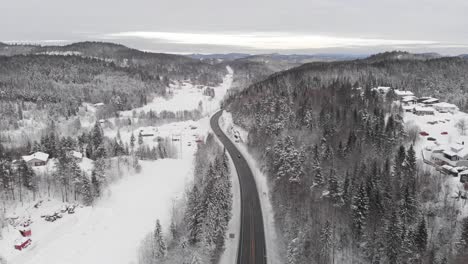 Bird's-Eye-View-Of-Land-Transportation-On-Asphalt-Highway-During-Winter