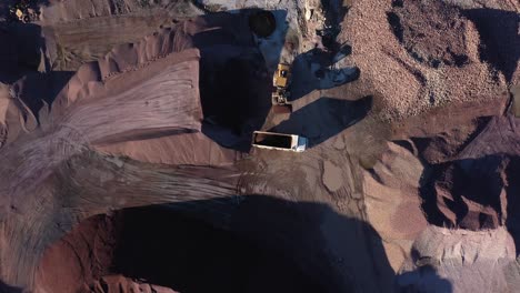 Aerial-view-of-trucks-in-a-sand-quarry
