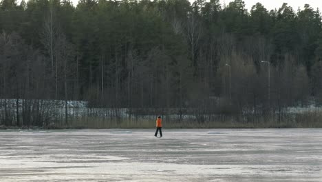 Woman-walking-across-a-frozen-lake