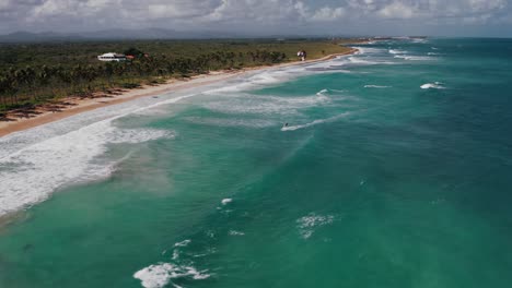 Kitesurfer-has-fun-along-palm-fringed-stretch-of-Caribbean-coastline